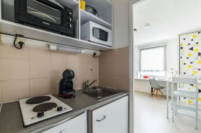 Cuisine ou kitchenette dans l'établissement Studio Payne - Welkeys