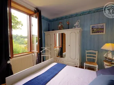 Un ou plusieurs lits dans un hébergement de l'établissement Gîte Charmant avec Terrasse et Jardin, Animaux Bienvenus - FR-1-496-90