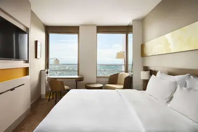 Un ou plusieurs lits dans un hébergement de l'établissement Radisson Blu Hotel, Lyon