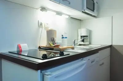 Cuisine ou kitchenette dans l'établissement Appart'City Classic Lyon Part-Dieu