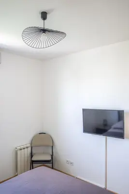 Télévision ou salle de divertissement dans l'établissement Petit nid douillet Décines