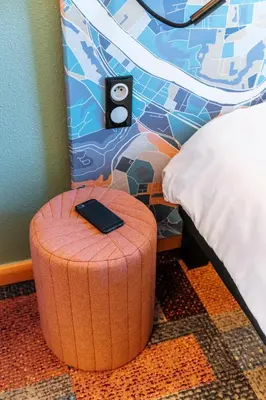 Un ou plusieurs lits dans un hébergement de l'établissement Ibis Styles Lyon Croix Rousse