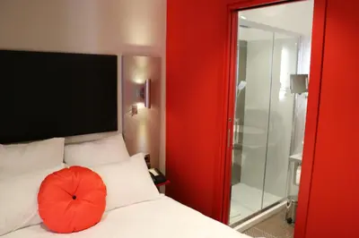 Un ou plusieurs lits dans un hébergement de l'établissement Hôtel Boutique Richelieu, Lyon Gare Part-Dieu
