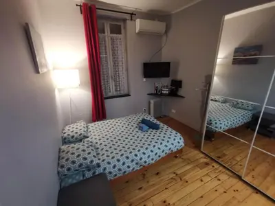 Un ou plusieurs lits dans un hébergement de l'établissement Studio Calme avec Jardin, Tram T6 & Métro D, Proche Hôpital Mermoz et Édouard Herriot