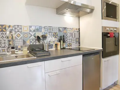 Cuisine ou kitchenette dans l'établissement Appartement écologique - Proche Métro Charpennes