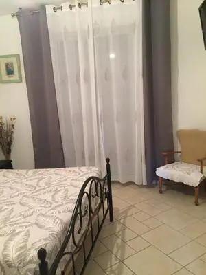 Un ou plusieurs lits dans un hébergement de l'établissement Chambres d'hôtes Chez Coco