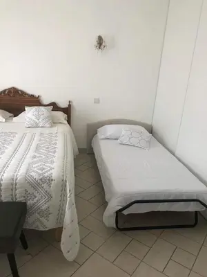 Un ou plusieurs lits dans un hébergement de l'établissement Chambres d'hôtes Chez Coco
