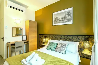Un ou plusieurs lits dans un hébergement de l'établissement Hôtel Tête d'or