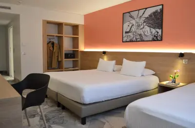 Un ou plusieurs lits dans un hébergement de l'établissement Hotel des Congrès