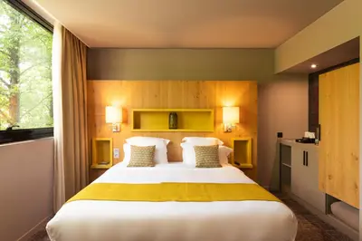 Un ou plusieurs lits dans un hébergement de l'établissement Domaine du Gouverneur, Hôtel, Restaurant & Golf