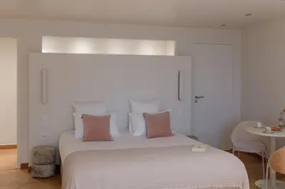 Un ou plusieurs lits dans un hébergement de l'établissement MiHotel Le Gourguillon