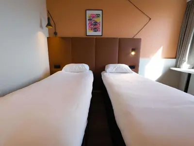 Un ou plusieurs lits dans un hébergement de l'établissement ibis Lyon Est Bron