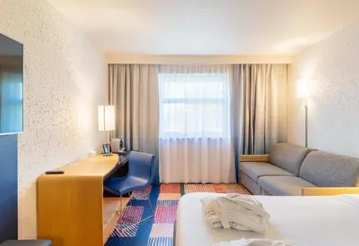 Coin salon dans l'établissement B&B HOTEL Lyon Nord 4 étoiles