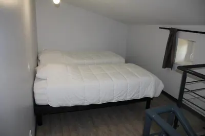 Un ou plusieurs lits dans un hébergement de l'établissement La Maison de Léobin