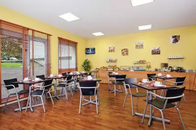 Restaurant ou autre lieu de restauration dans l'établissement Séjours & Affaires Lyon Park Lane