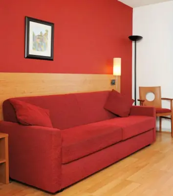 Coin salon dans l'établissement Séjours & Affaires Lyon Park Lane