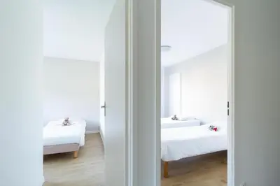 Un ou plusieurs lits dans un hébergement de l'établissement Garden & City Lyon - Lissieu