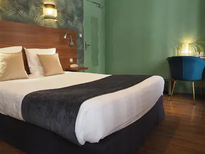 Un ou plusieurs lits dans un hébergement de l'établissement Hôtel du Dauphin