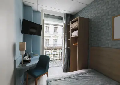 Un ou plusieurs lits dans un hébergement de l'établissement Hôtel du Dauphin