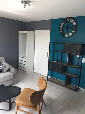 Coin salon dans l'établissement Résidence Studio Grand Luxe Wifi parking privé