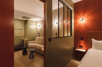 Un ou plusieurs lits dans un hébergement de l'établissement Hôtel de Noailles