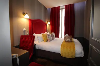 Un ou plusieurs lits dans un hébergement de l'établissement Hôtel Alexandra