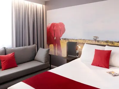 Un ou plusieurs lits dans un hébergement de l'établissement Novotel Lyon Gerland Musée des Confluences