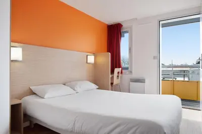 Un ou plusieurs lits dans un hébergement de l'établissement Premiere Classe Lyon Est - Bron Eurexpo