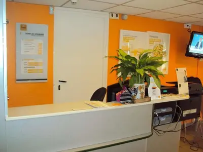 Télévision ou salle de divertissement dans l'établissement Premiere Classe St Etienne Nord Villars