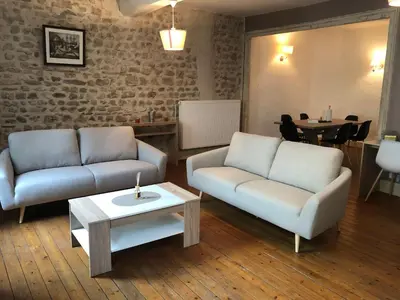 Coin salon dans l'établissement Spacieux appartement 2/6 pers 110m² proche CNPE