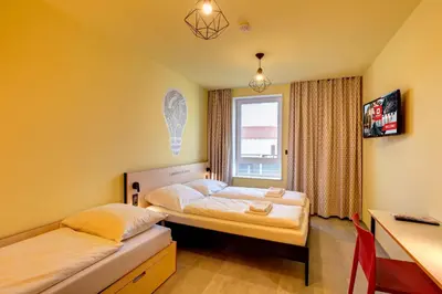 Un ou plusieurs lits dans un hébergement de l'établissement MEININGER Hotel Lyon Centre Berthelot
