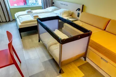 Un ou plusieurs lits dans un hébergement de l'établissement MEININGER Hotel Lyon Centre Berthelot