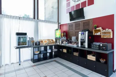 Cuisine ou kitchenette dans l'établissement Garden & City Lyon - Marcy