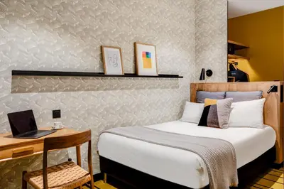 Un ou plusieurs lits dans un hébergement de l'établissement Republik Hotel