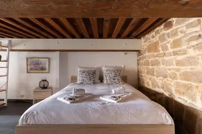 Un ou plusieurs lits dans un hébergement de l'établissement GuestReady - Le Duplex des pentes