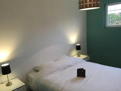 Un ou plusieurs lits dans un hébergement de l'établissement Les Villas du Domaine de Suzel
