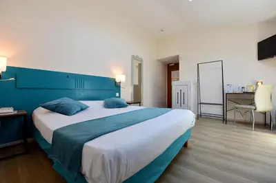 Un ou plusieurs lits dans un hébergement de l'établissement Hôtel du Parc
