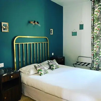 Un ou plusieurs lits dans un hébergement de l'établissement Grand Hotel De La Poste - Lyon Sud - Vienne