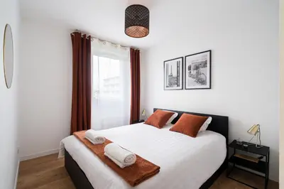 Un ou plusieurs lits dans un hébergement de l'établissement casa Lyon Appartement lumineaux