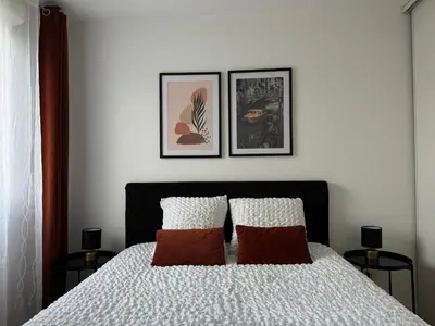 Un ou plusieurs lits dans un hébergement de l'établissement casa Lyon Appartement lumineaux