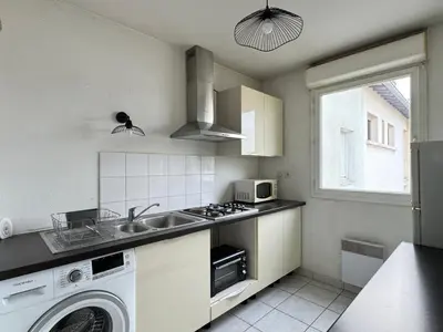 Cuisine ou kitchenette dans l'établissement casa Lyon Appartement lumineaux