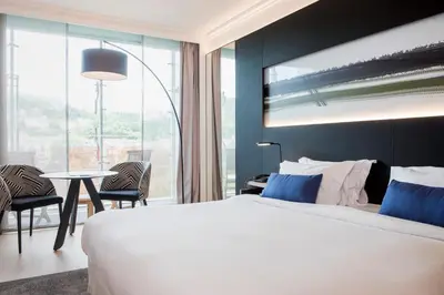 Un ou plusieurs lits dans un hébergement de l'établissement Lyon Marriott Hotel Cité Internationale