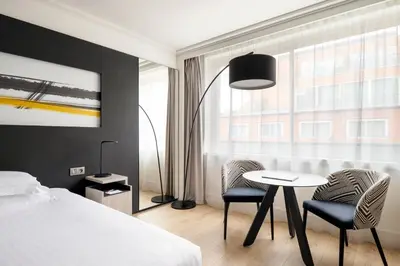 Un ou plusieurs lits dans un hébergement de l'établissement Lyon Marriott Hotel Cité Internationale