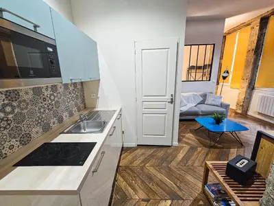 Cuisine ou kitchenette dans l'établissement Le Bleu hypercentre Presque île