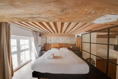 Un ou plusieurs lits dans un hébergement de l'établissement GuestReady - Magnificent duplex canut hypercentre