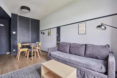 Coin salon dans l'établissement Appart'hôtel Odalys City - Bioparc Lyon Est