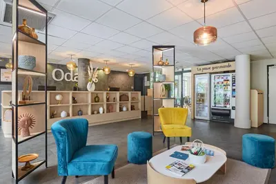 Coin salon dans l'établissement Appart'hôtel Odalys City - Bioparc Lyon Est