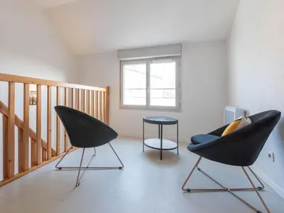 Coin salon dans l'établissement Duplex coquet avec PARKING proche centre-ville de Lyon