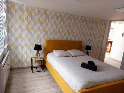 Un ou plusieurs lits dans un hébergement de l'établissement MONTALIEU SEJOUR Rez de jardin Les jonquilles - 1 à 4 PERS - PROX CNPE BUGEY - VALLEE BLEU - VIA RHONA
