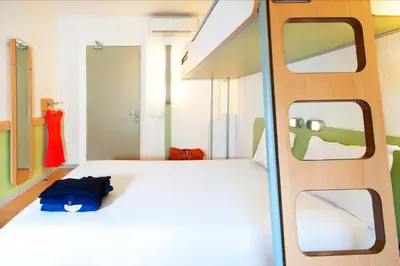 Un ou plusieurs lits dans un hébergement de l'établissement ibis budget Lyon Sud St Genis Laval